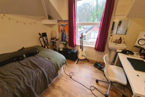 Cozy bedroom featuring a comfortable bed, a spa...