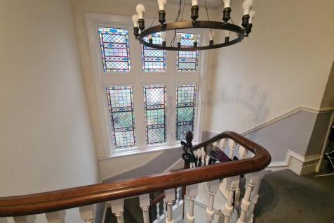 A charming staircase with a classic wooden hand...