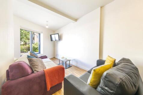 Bright and cozy living room featuring comfortab...