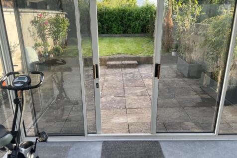 A bright and inviting garden space viewed throu...