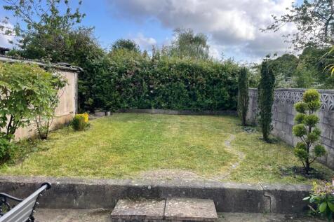 A well-maintained private garden featuring a ne...