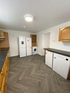 Spacious kitchen with modern appliances includi...