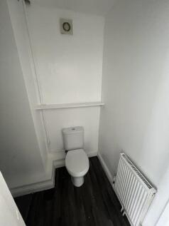 A clean, well-maintained single toilet space fe...