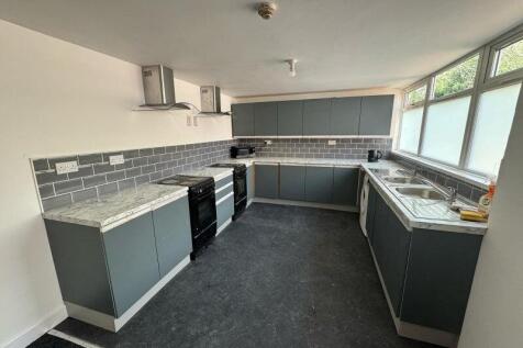 Bright and modern kitchen with ample countertop...