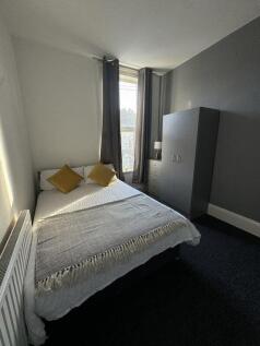 Bright and tidy double bedroom featuring a comf...