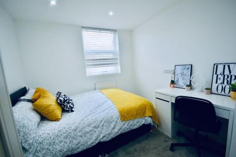 This inviting double bedroom features modern de...