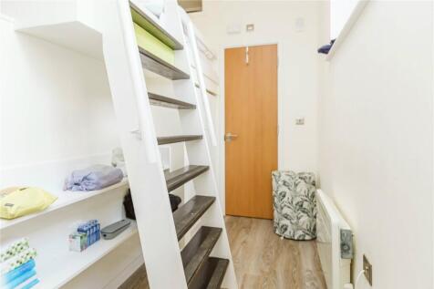 A bright and clean staircase area with modern w...