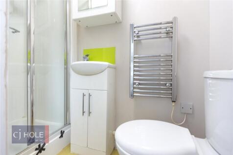 A bright and well-maintained bathroom featuring...