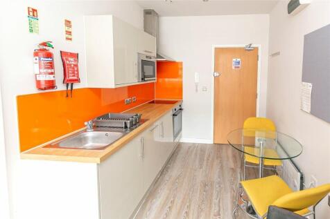 Bright and modern kitchen featuring a vibrant o...