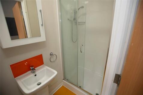 Bright and clean bathroom featuring a modern sh...