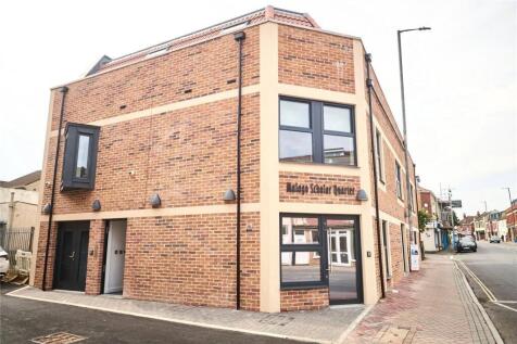A well-maintained modern brick terraced buildin...