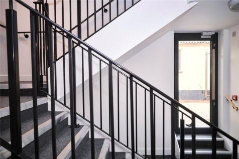 A clean and well-maintained staircase area feat...