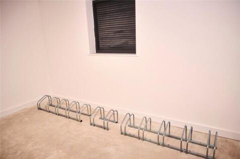 A clean and tidy storage room featuring a metal...