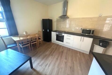 Bright and modern kitchen with ample natural li...