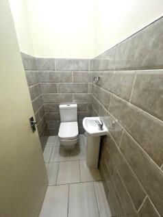 A clean and modern small toilet area featuring ...