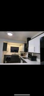 A modern kitchen with a clean design and good a...