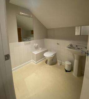 A well-maintained bathroom featuring modern fix...