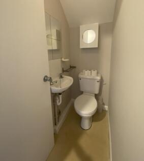 A well-maintained single toilet featuring a mod...