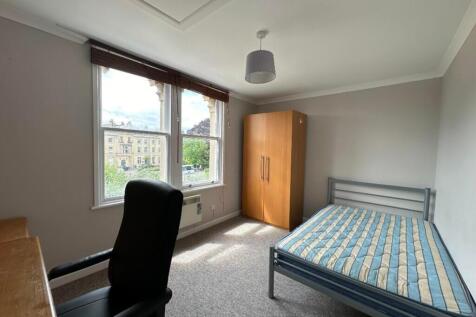Bright and spacious double bedroom featuring la...