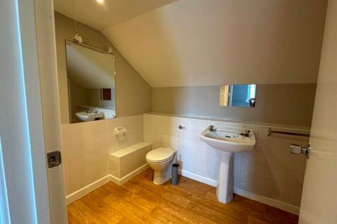 A modern bathroom featuring a clean and tidy de...