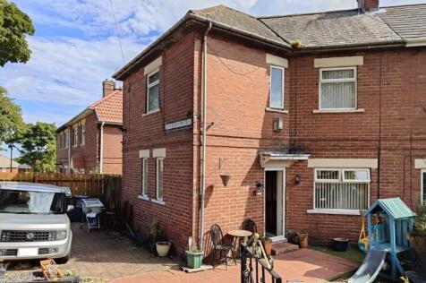 A charming semi-detached brick house with a wel...