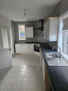 A bright kitchen with ample counter space and m...