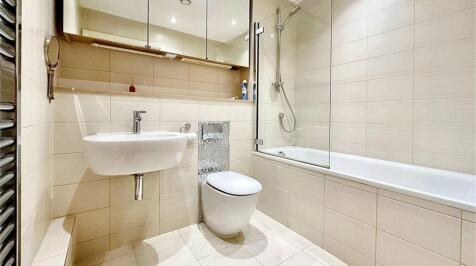 A modern, well-maintained bathroom featuring a ...