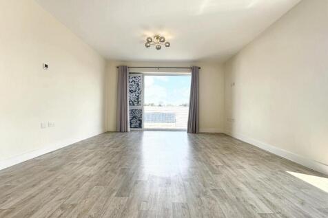 Bright and spacious living room featuring clean...