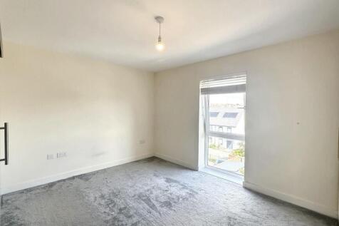 A bright and clean double bedroom featuring a l...