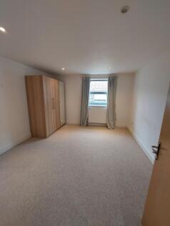 Bright and tidy double bedroom featuring a larg...