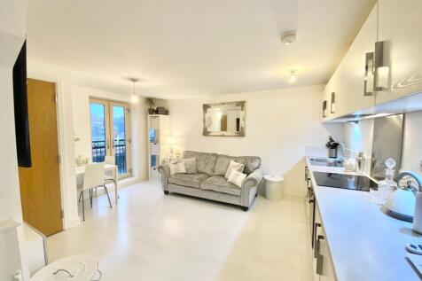 Bright and modern open-plan living room with a ...