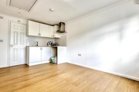 Bright and spacious living room with sleek wood...
