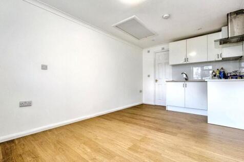 Bright and clean kitchen area with modern white...
