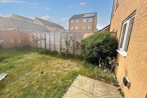 A bright and inviting garden space featuring a ...