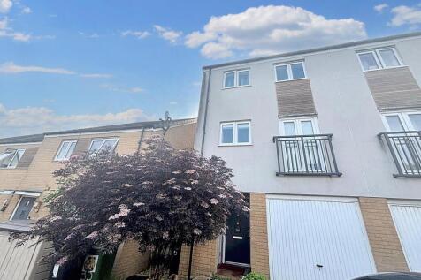 Bright and inviting front view of a modern terr...