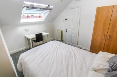 Bright and cozy double bedroom featuring a comf...