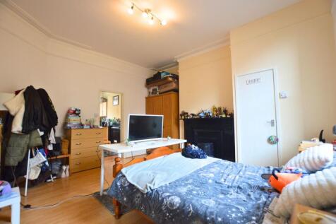 Bright and cozy double bedroom featuring a comf...