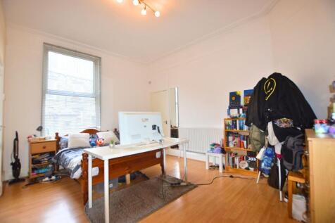 Bright and spacious double bedroom featuring a ...