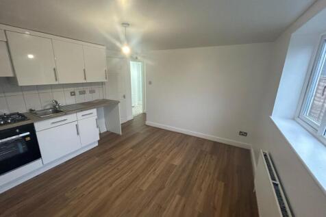 Bright and tidy kitchen space featuring modern ...
