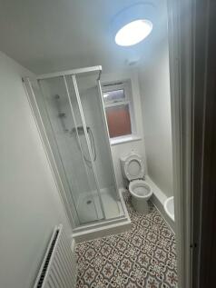 A clean and well-maintained bathroom featuring ...