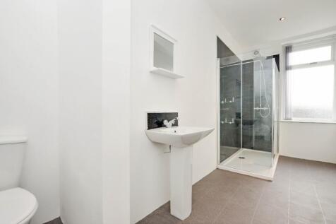 Bright and clean bathroom featuring a modern wa...