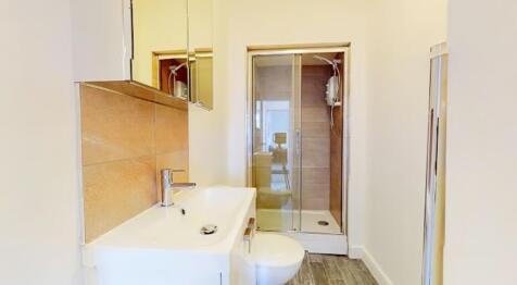 This modern bathroom features a sleek design wi...