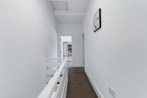 A clean and tidy hallway that provides a welcom...