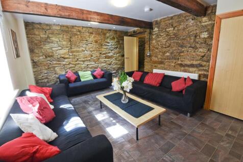 A cozy and stylish living room featuring expose...