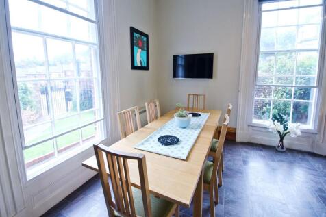 A bright and welcoming communal lounge featurin...