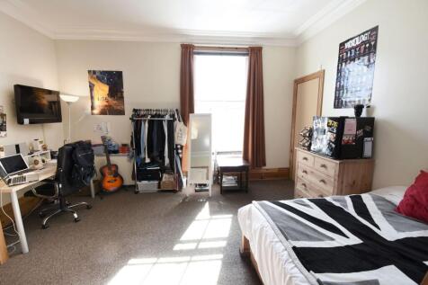 Bright and spacious double bedroom featuring a ...
