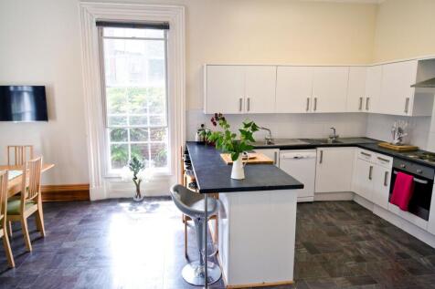 Bright and modern kitchen featuring a spacious ...