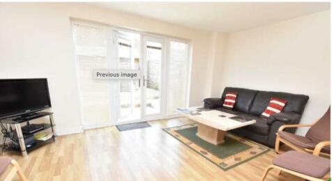 Bright and welcoming living room featuring a co...