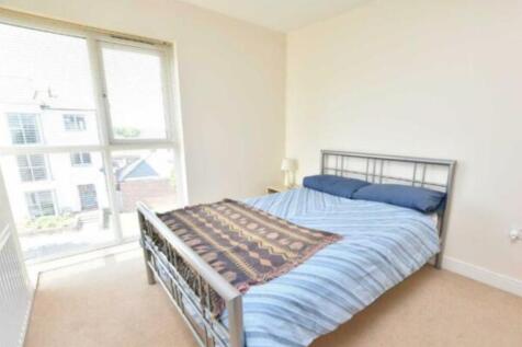 Bright and airy double bedroom featuring a comf...