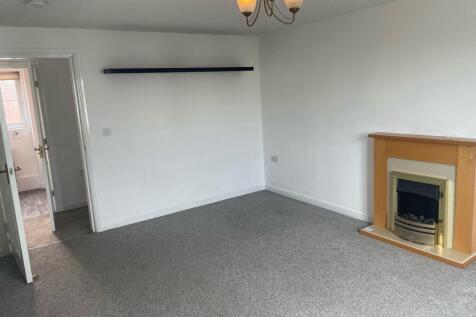 A clean and well-maintained living room featuri...